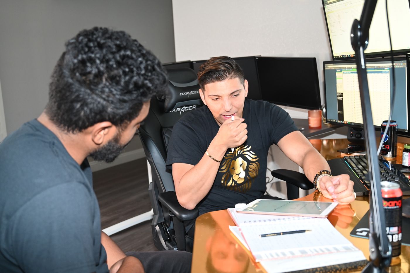 Ricky Andrade mentoring a student at his trading desk